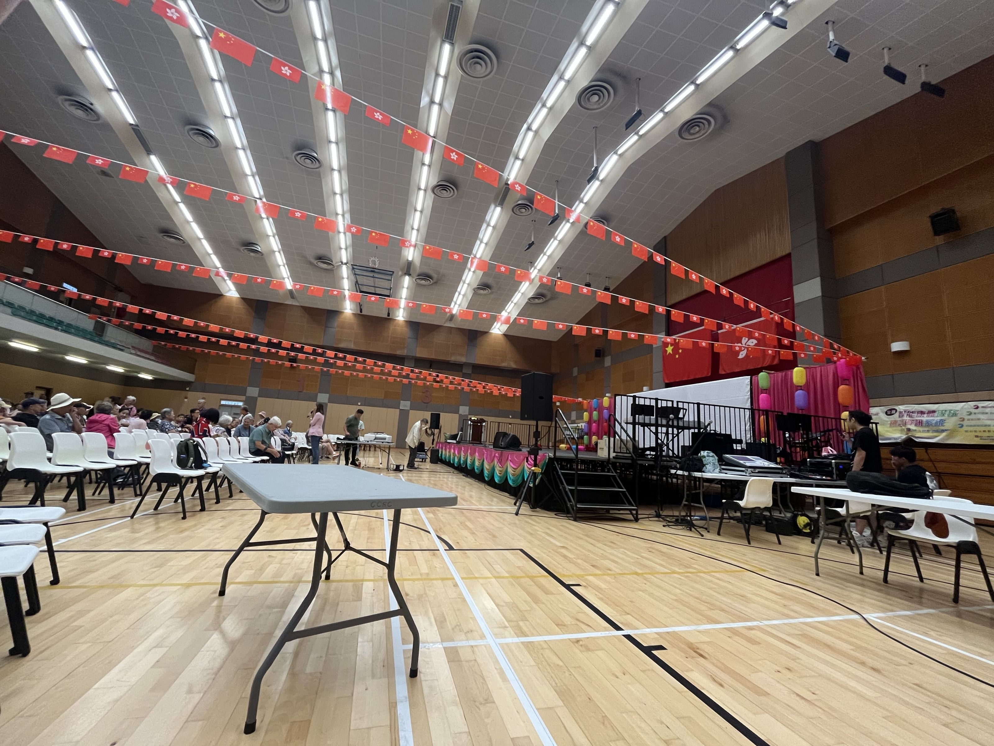 Indoor community hall with stage, PA, and seating